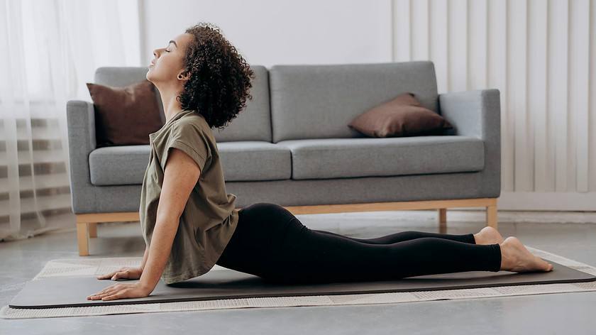 side view of woman doing yoga