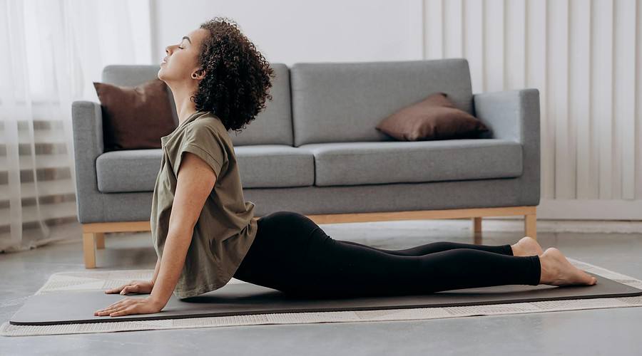 side view of woman doing yoga