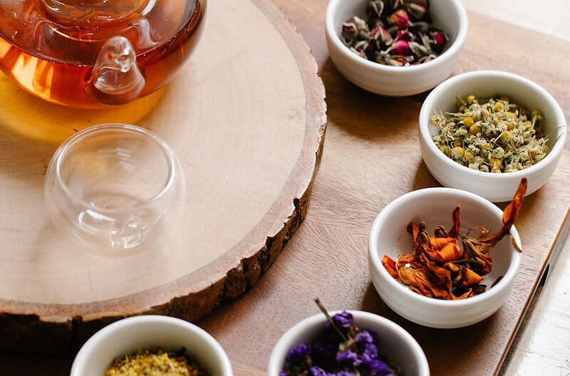 assorted herbs on bowls