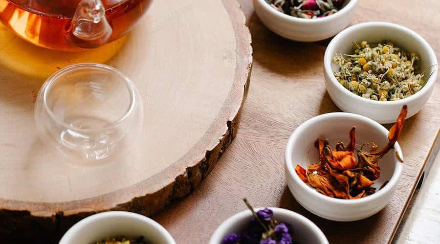 assorted herbs on bowls